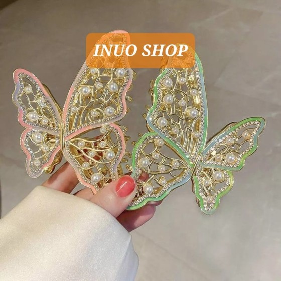 Pinza con forma de mariposa con perlas